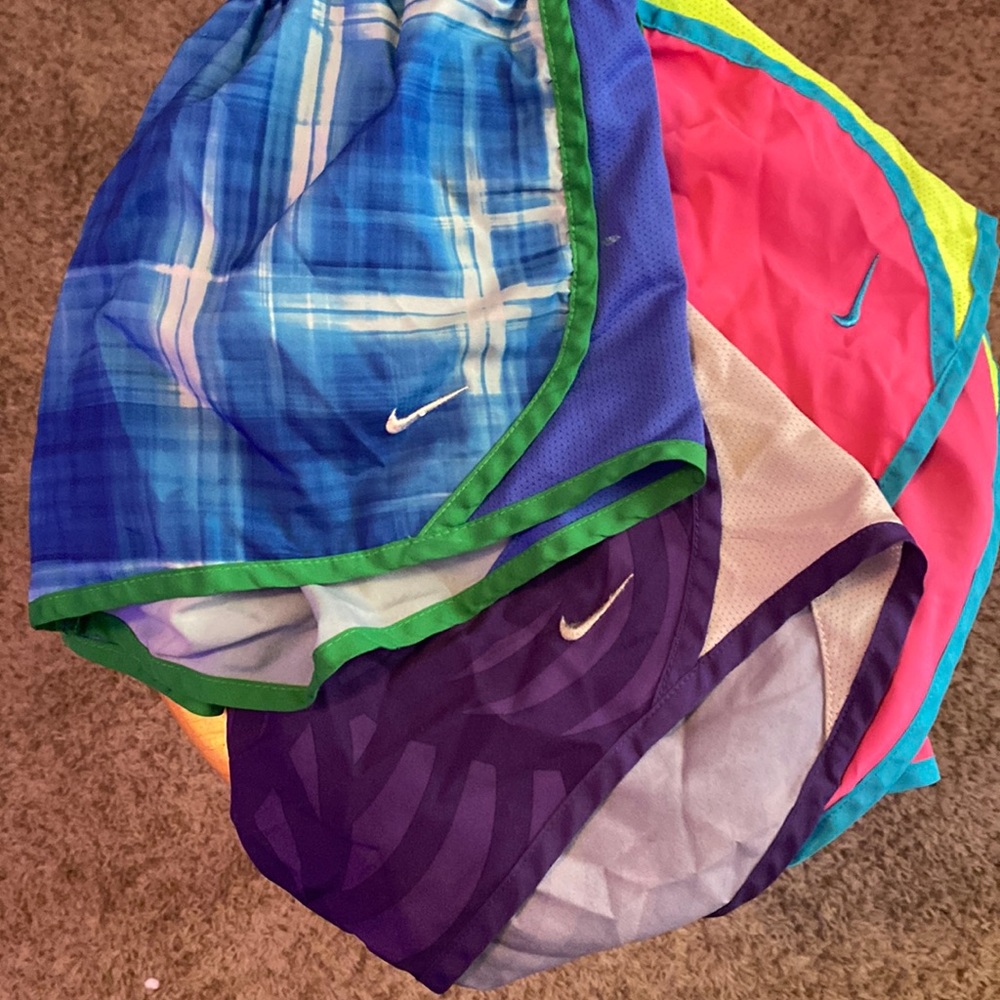 3 Nike dry-fit shorts blue is M purple and pink are L